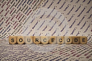 Sourcecode - cube with letters and words from the computer, software, internet categories, wooden cubes
