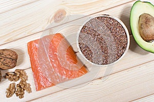 Sources of omega 3 fatty acids: flaxseeds, avocado, salmon and walnuts