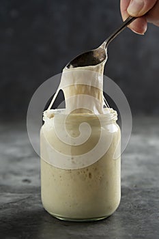 Sourdough in a glass jar. Cooking homemade, rustic sourdough bread