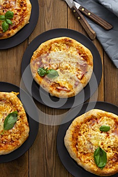 Sourdough Pizza homemade baked pizza rolls, or mini pizza on wooden background