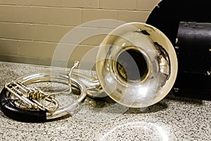 Sousaphone resting before the start of marching band rehearsal photo