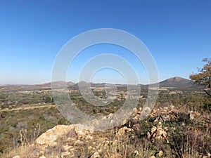 South Africa scenic bushveld landscape photograph under a blue sky