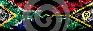 South Africa vs Vanuatu smoky mystic flags placed side by side. Thick colored silky abstract smoke flags concept
