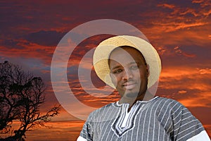 South African black man on sunset background