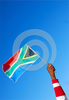 South African flag in black hand