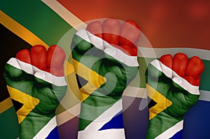 The South African flag is drawn on a clenched fist and in the background.