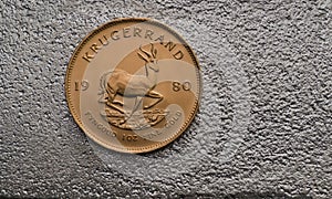 South African Gold Coin Krugurand on Silver Bar