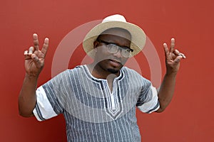 South African man with victory sign hands
