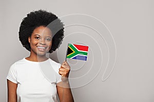 South African woman holding flag of South Africa Education, business, citizenship and patriotism concept