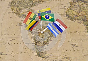 South America continent with flag pins of sovereign states on map