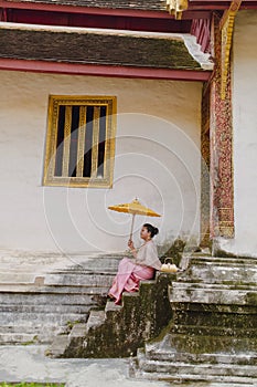 South Asian girl in Wat Phra Singh Temple in Chiang Mai Thailand