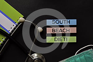 South Beach Diet! on top view black table and Healthcare/medical concept