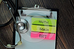 South Beach Diet! on top view Wooden Table and Healthcare/medical concept