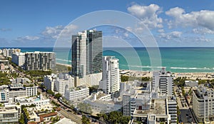 South Beach sandy surface with tourists relaxing on hot Florida sun. Tourism infrastructure in southern USA. Miami Beach