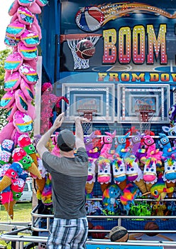 Man Playing basketball carnival game