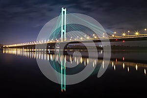 The South bridge at night, Kiev, Ukraine. Bridge at sunset across the Dnieper River. Kiev bridge against the backdrop of