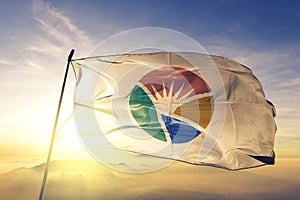 South Gyeongsang province of South Korea flag textile cloth fabric waving on the top sunrise mist fog