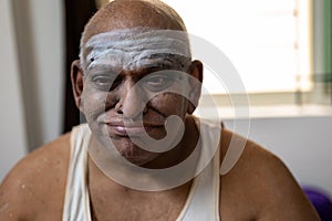 A South indian aged Fat Man with Funny face