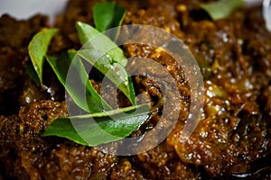 South Indian cuisine Kerala Style Beef fry / roast. Traditional style meat roast. Garnished with curry leaves. Selective focus