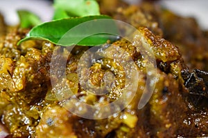 South Indian cuisine Kerala Style Beef fry / roast. Traditional style meat roast. Garnished with curry leaves. Selective focus