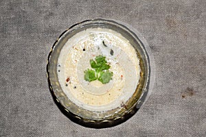 south indian cuisine - White coconut chutney served in a glass bowl