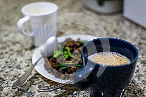 A south indian dish called ground nut masala with tea decorated with mint and curry leaves