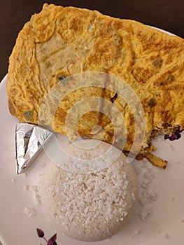 South Indian food puttu and egg omlet on a plate