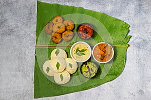 South Indian foods Idli, Medu Vada,dosa with Sambar,coconut chatney and tomato chatney.
