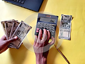 South Indian man five hundred rupees notes.