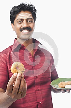 South Indian man having vada