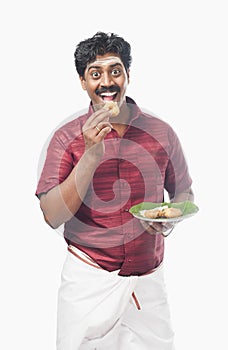 South Indian man having vada