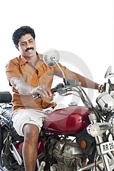 South Indian man riding a motorcycle