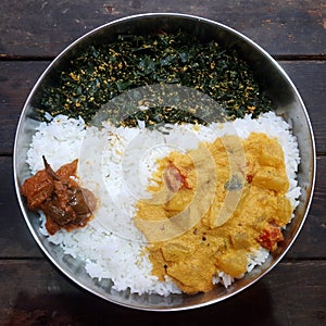 South indian`s famaous food Rice, Drum stick leafs fry, vegetables curry and pickle