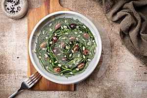 South Italian Salad with Sauteed Agretti or barba di frati with garlic photo