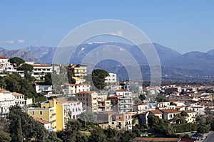 South of Italy, Calabria. Colorful Cabins on Scalea Beach with a Bright Blue Sky and Beautiful Mountains in the Background.