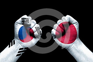 South Korea and Japan conflict, international relations crisis, flag on human hand background concept