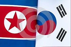 South Korea and North Korea flag together. concept of interaction or counteraction between the two countries