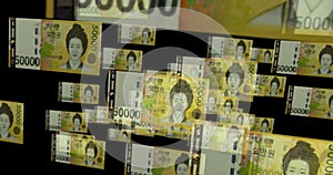 South Korea Won 50000 banknote â€“ flying between transparent money