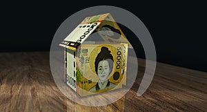 South Korea Won 50000 KRW money banknotes paper house on the table 3d illustration