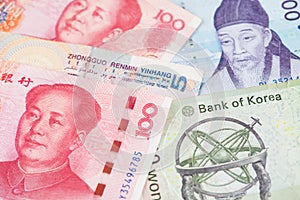 South Korea Won and China Yuan banknotes close up image.