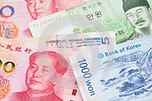 South Korea Won and China Yuan Renminbi currency banknotes.