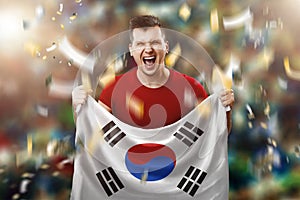 South Korean fan, a fan of a man holding the national flag of South Korea in his hands. Soccer fan in the stadium. Mixed media