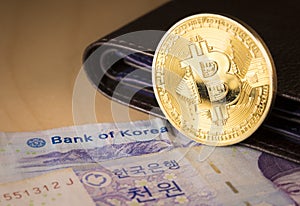 South Korean won currency and bitcoin. Business concept.