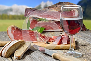 South Tyrolean snack with bacon and wine in alpine region