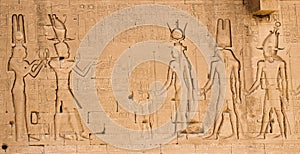 The south wall of the temple of Hathor at Dendera with lion-headed waterspouts. Cleopatra and her son Caesarian on the left side