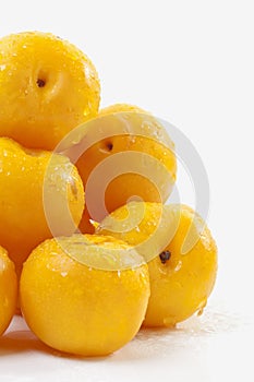 Southafrican yellow plums on white background photo