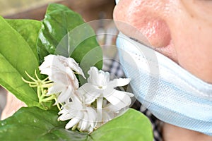 Southeast Asian, Chinese and Myanmar old man with cold flu gets loss of smell called anosmia photo