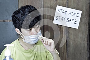 Southeast Asian, Chinese and Myanmar young man with cold flu gets loss of smell called anosmia