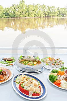 Southeast Asian cuisine set, Japanese shrimps with salad, Fish organs sour soup Thai style, Fish sauce Southern style, fried