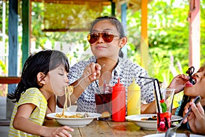 Southeast Asian Ethnicity Family Lifestyle, Mother Having Lunch Together with Her Kids at A Restaurant